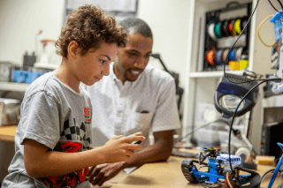 Big and Little building a robot together