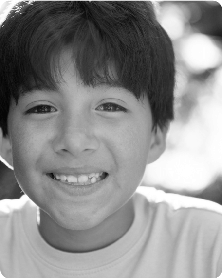 Black and white picture of kid smiling